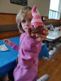 Summer Suomi School girl holding finished craft.